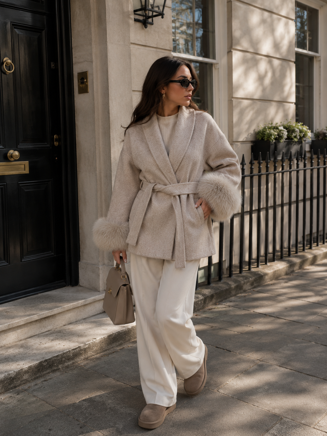 Side profile of women's A-line short wool coat with fur trim