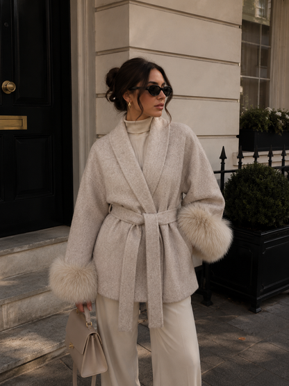 Close-up of fox fur trim on collar of women's elegant wool coat