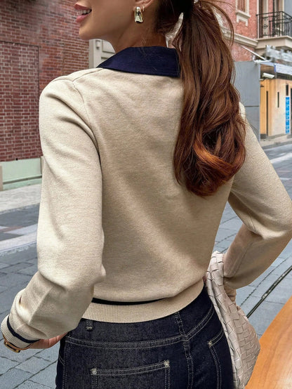 Close-up of ribbed knit texture and polo neckline on women's color block top