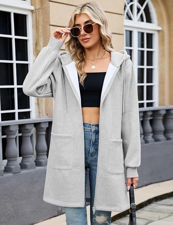 Elvienne black zip-up cardigan showing relaxed fit and long sleeves