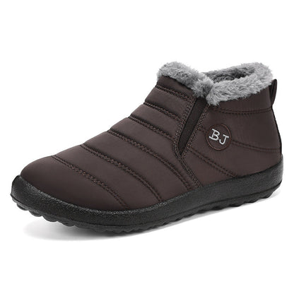 Ember winter boots worn outdoors on wet and icy ground