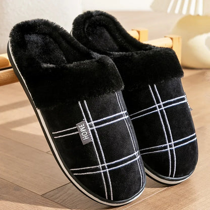 Huxley plush cotton slippers in grey worn indoors