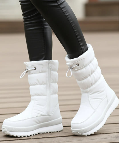 Women's quilted puffer snow boots black side zipper close-up