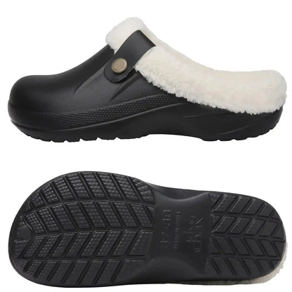 Norval slippers in black and white colourway on a neutral background