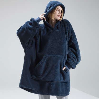 Close-up of double-faced plush fleece fabric texture on oversized hoodie robe
