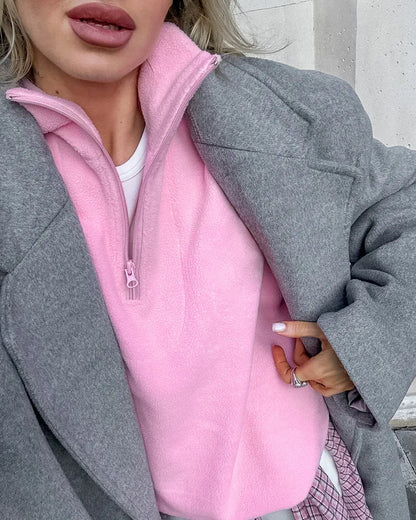 Close-up of half-zip fastening on Selvie women's fleece sweatshirt