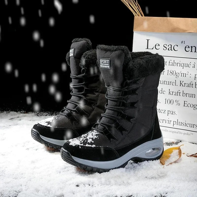 Side profile of Sylvara women's mid-calf waterproof boots in white
