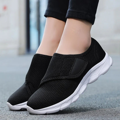 Sole and heel view of cushioned wide-fit walking shoe