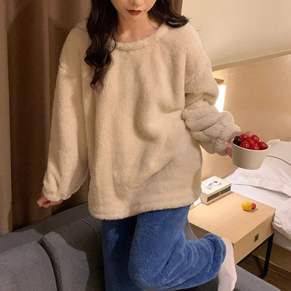 Side view of women's fluffy fleece pyjama jumper and trousers