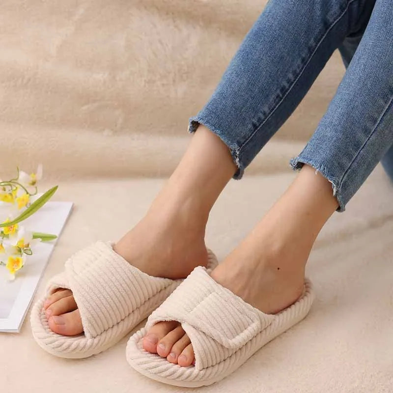 Beige women's fuzzy open-toe slides, top-down view showing lining