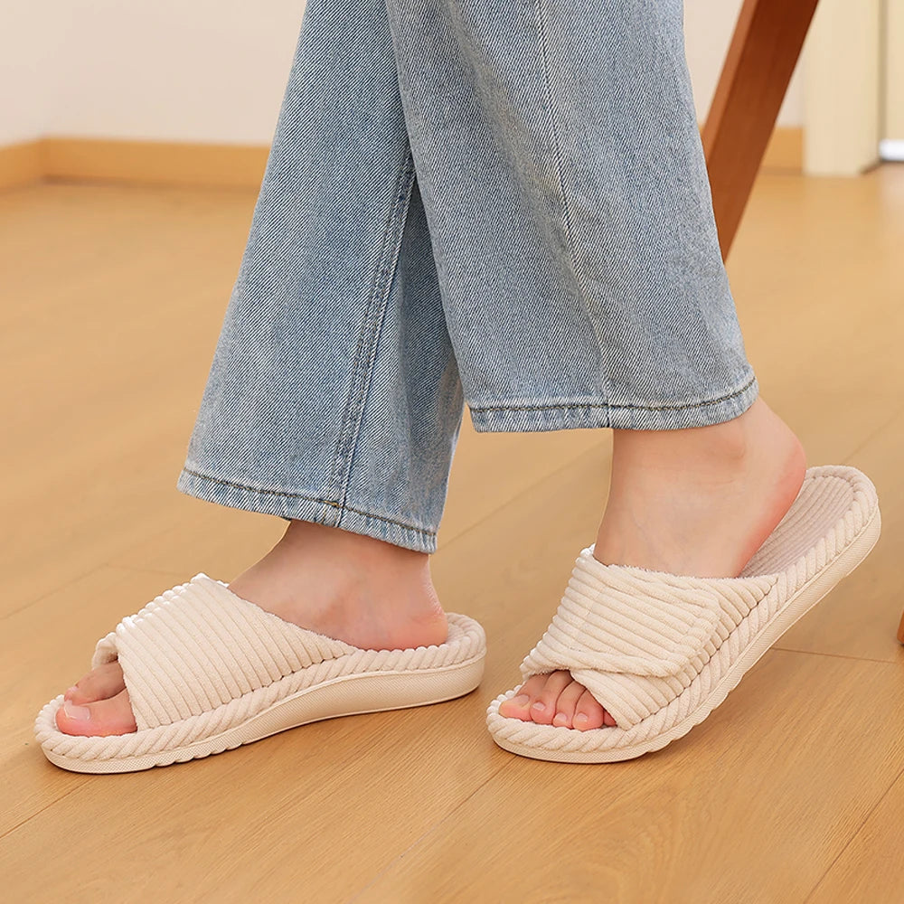 Side view of women's faux fur lined cotton bedroom slippers