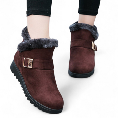 Front view of women's suede leather ankle boots in black