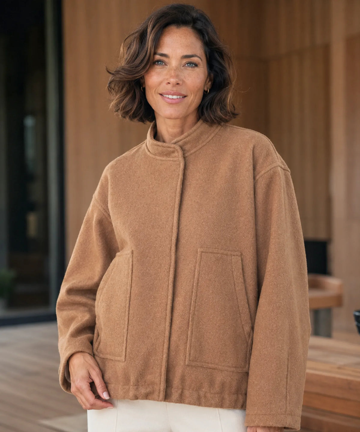 Close-up of front zipper on nude coloured bouclé bomber jacket