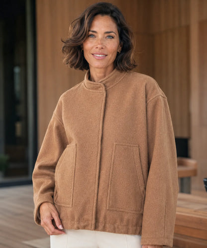 Close-up of front zipper on nude coloured bouclé bomber jacket