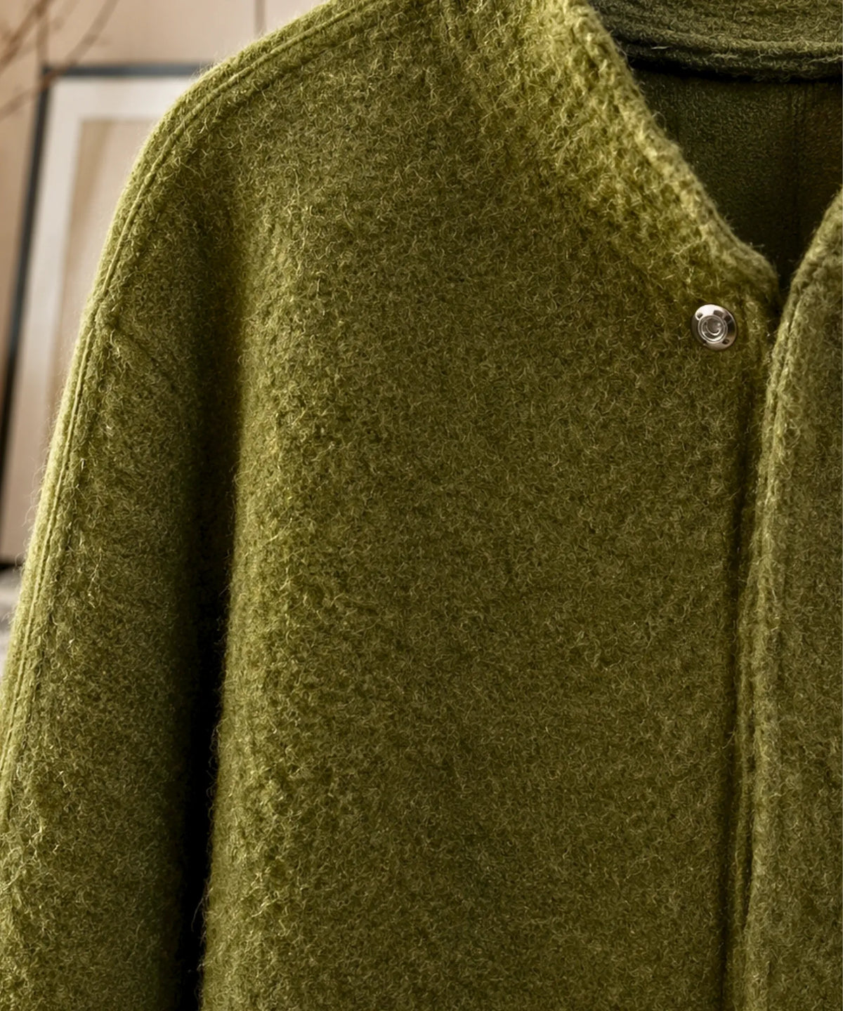 Oversized bouclé wool jacket in grey showcasing relaxed silhouette