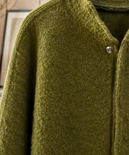 Oversized bouclé wool jacket in grey showcasing relaxed silhouette