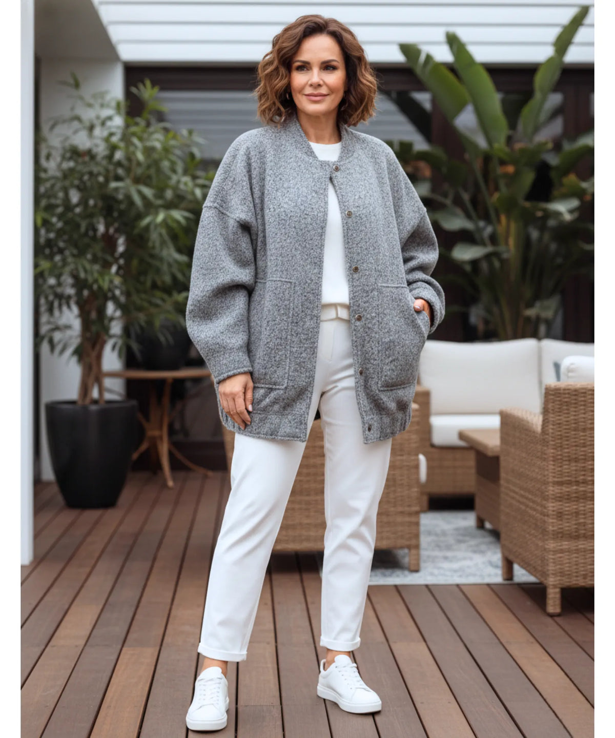 Flatlay of women's oversized bouclé bomber jacket in nude showing full design