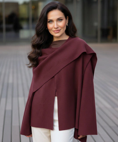 Side profile of women's wool wrap coat showing fluid drape