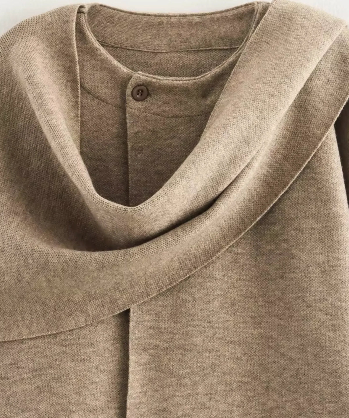 Women's oversized coat in burgundy showing heavyweight knit structure