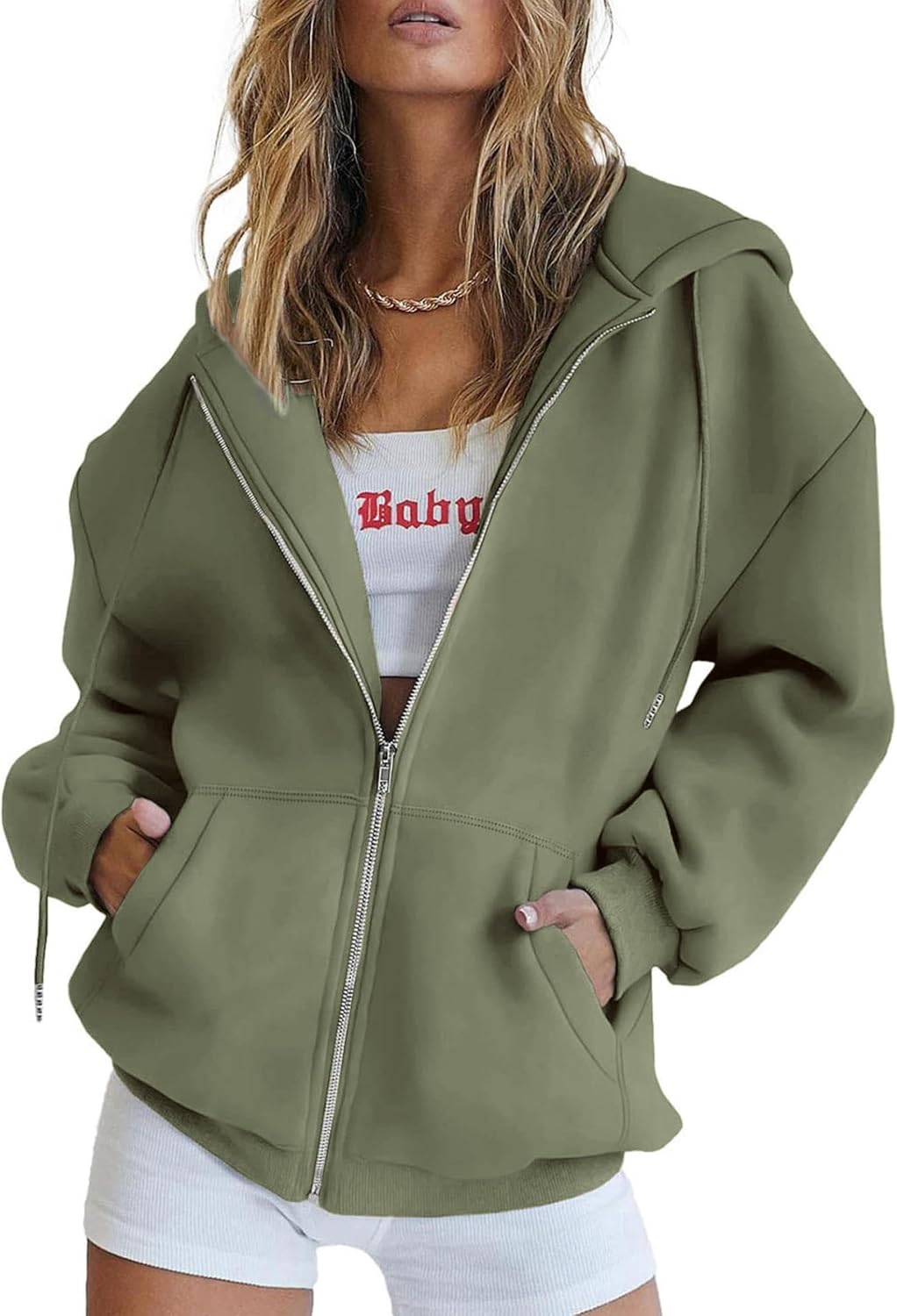 Side profile of women's oversized hoodie in light brown highlighting drop shoulders