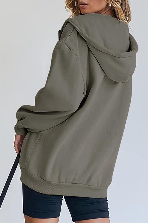 Women's oversized hoodie in white styled with blue jeans for a casual look