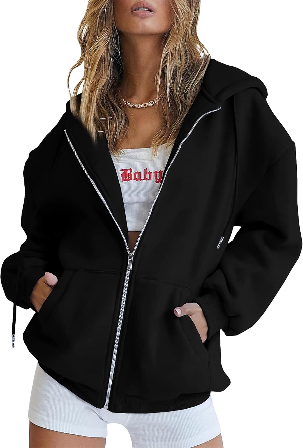 Women's oversized hoodie in red with hood up and hands in front pockets