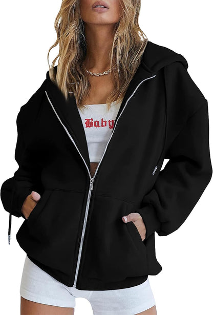Women's oversized hoodie in red with hood up and hands in front pockets