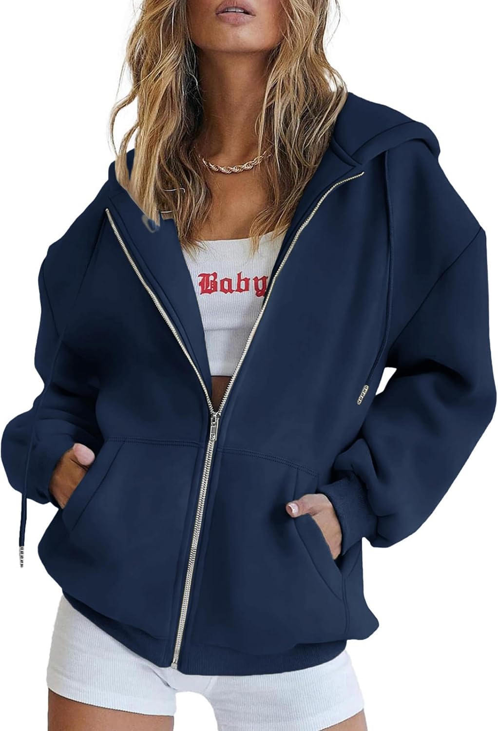 Women's relaxed-fit zip-up hoodie in dark grey worn as a layering piece