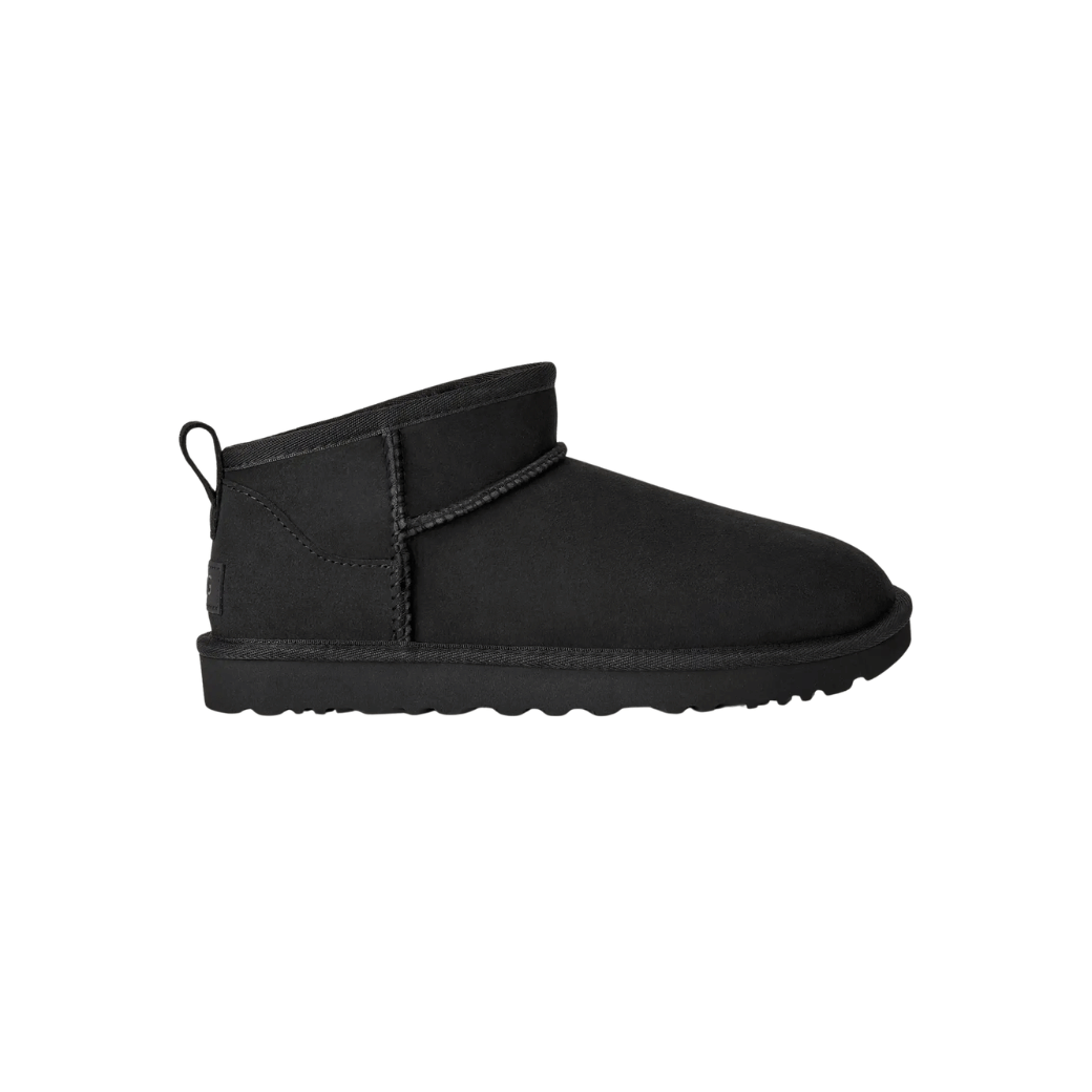 Chestnut women's mini boot worn outdoors on cobblestone