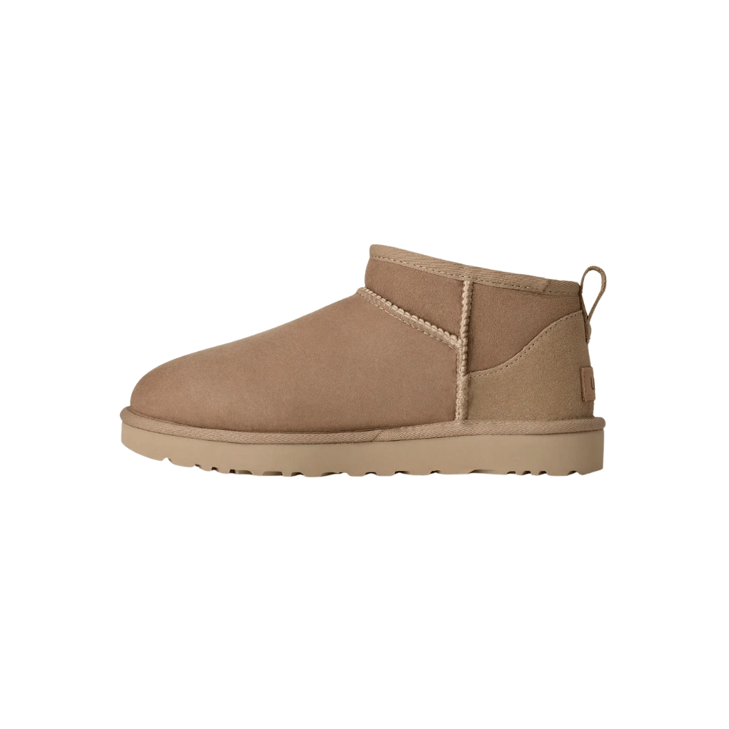 Black women's mini sheepskin boots on white background