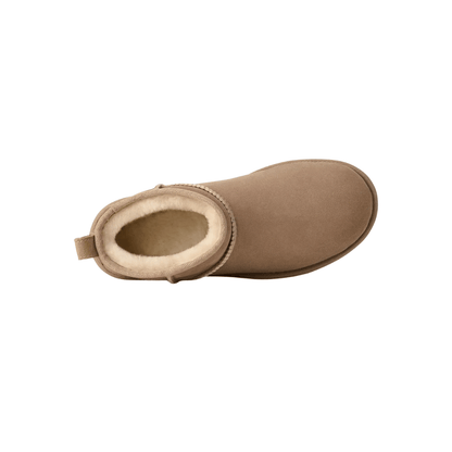 Side profile of women's sheepskin mini boot showing shaft height