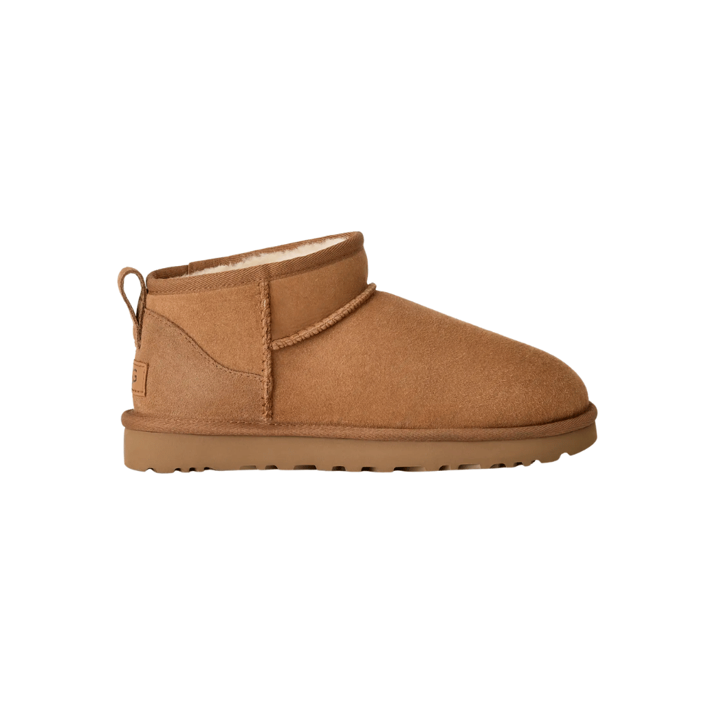 Water-resistant sheepskin mini boot in light rain setting