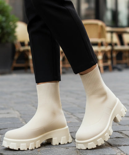 Women's tonal chocolate sock boot with platform lug sole and mid-calf shaft