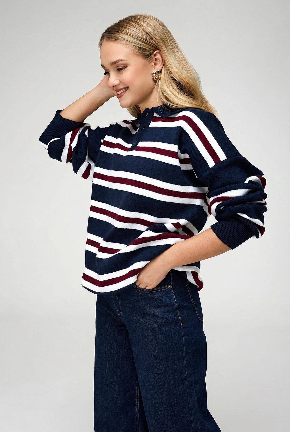 Close-up of polo collar and button detail on women's knit sweater