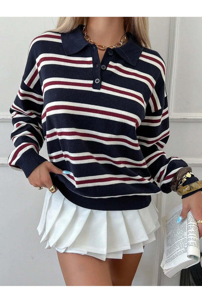 Women's button-neck knit sweater styled with casual trousers