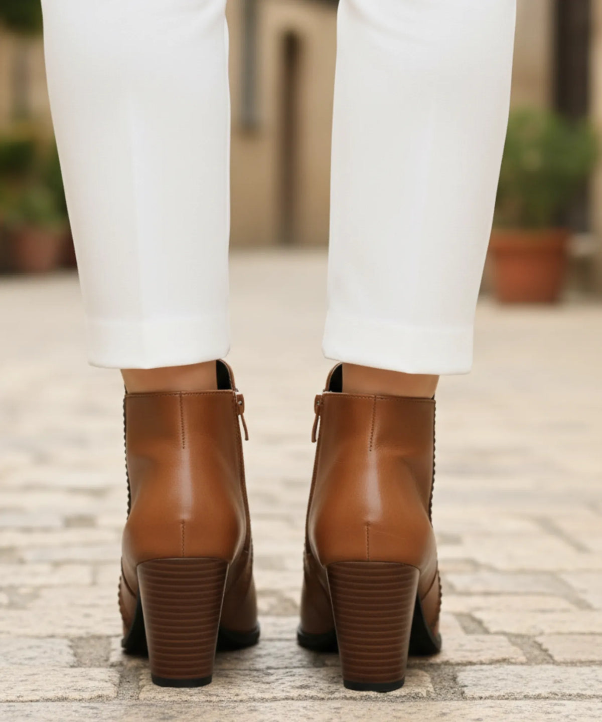 Top-down view of women's vegan leather ankle boots showing snug ankle fit