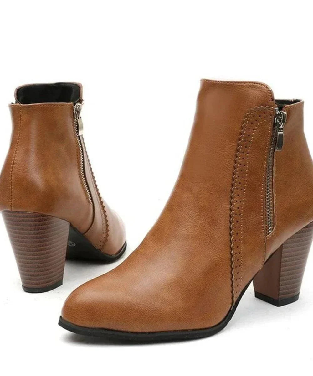 Detail shot of the structured block heel on Selena women's leather ankle boots