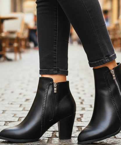 Women's block heel ankle boots in black styled with tailored trousers