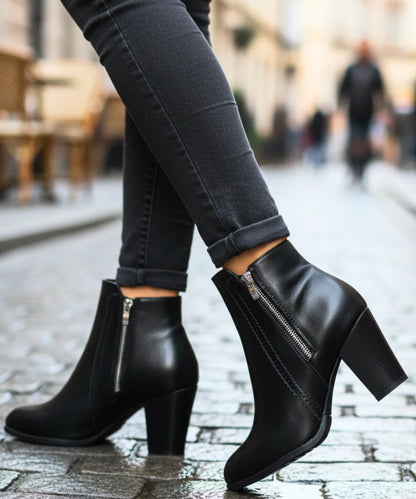 Close-up of perforated seam detail on Selena women's vegan leather boots