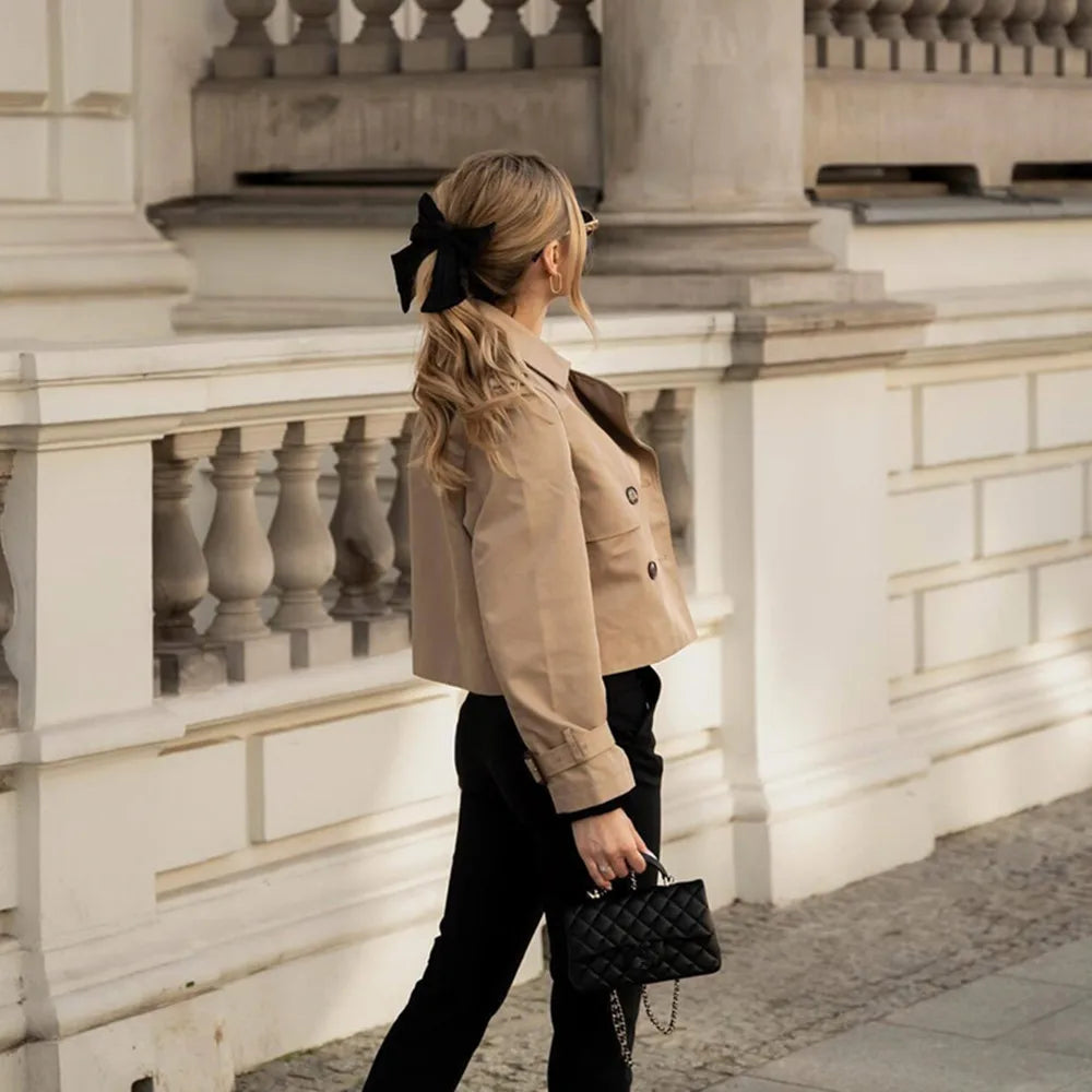 Brown double-breasted crop jacket with full-length sleeves and button detail