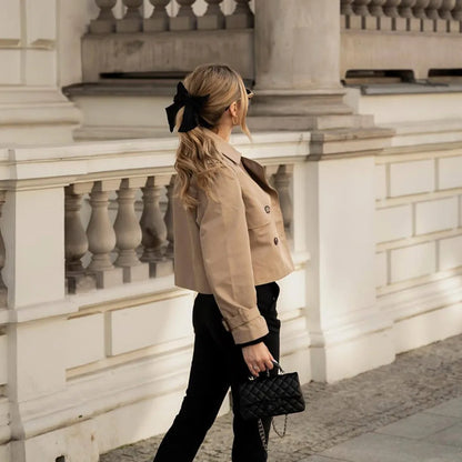 Brown double-breasted crop jacket with full-length sleeves and button detail