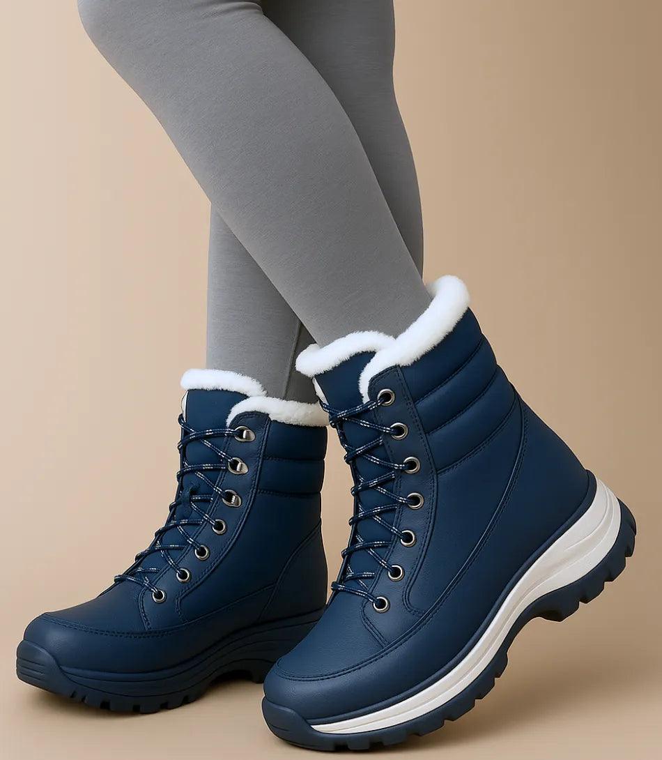 Women's mid-calf snow boots worn in snowy outdoor setting with fur trim visible
