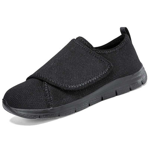 Rear view of black velcro sneakers with pull tab